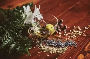 cup of herbal tea on a dark wood table